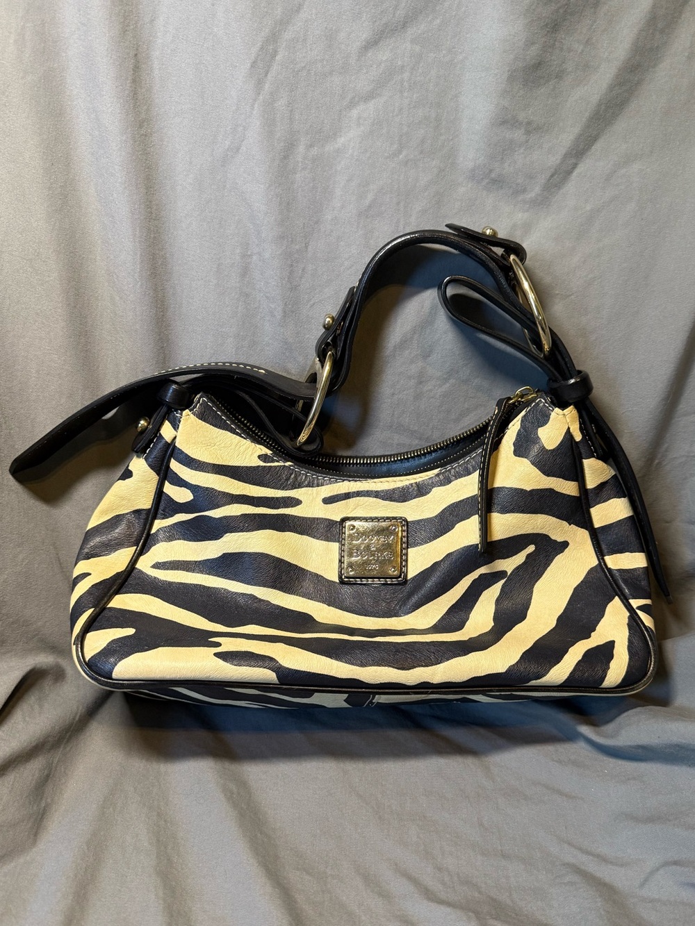 Dooney & Bourke Black and Cream Zebra-Print Shoulder Bag with Gold Plaque